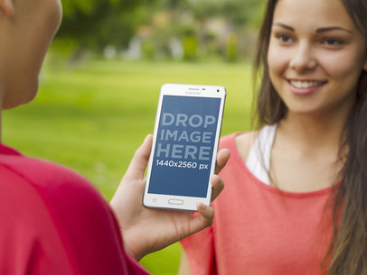 Samsung Galaxy Note Mockup of Friends at the Park | Mockup Generator