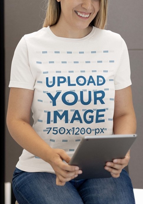 Crewneck Bella Canvas Tee Mockup Featuring a Woman Using a Tablet