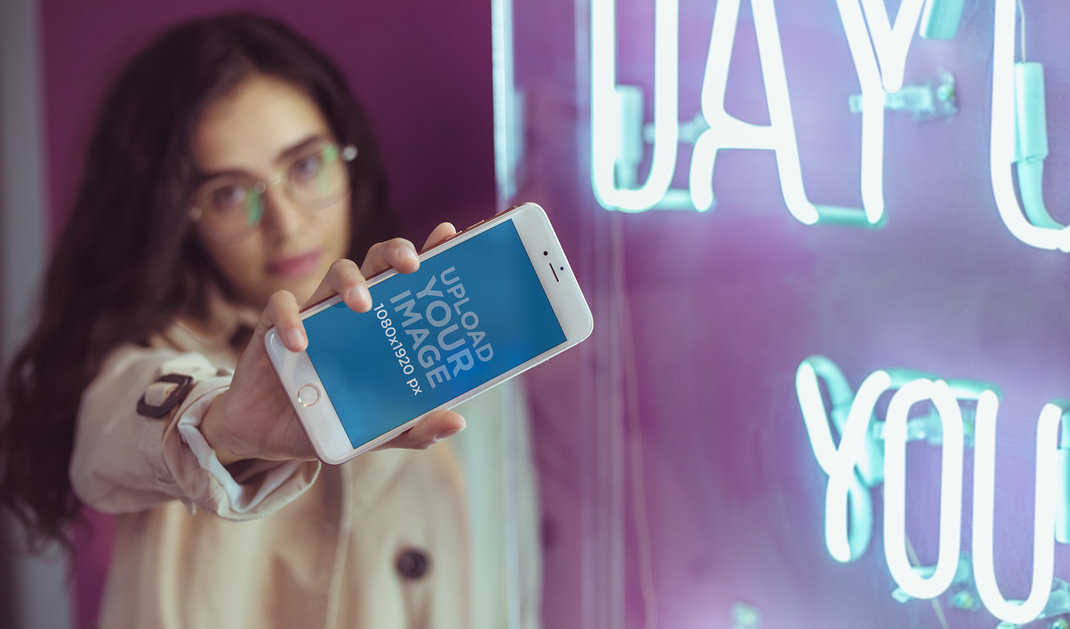 Rose Gold iPhone 7 Plus Mockup Being Held by a Woman with Glasses