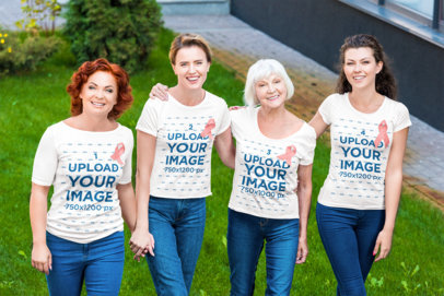 Round-Neck Tee Mockup of a Group of Women Wearing Pink Ribbons for Cancer Awareness