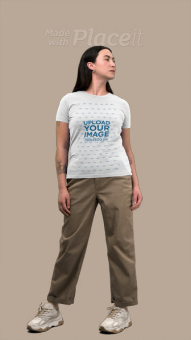 Bella Canvas T-Shirt Video of a Tattooed Serious Woman Posing in a Studio