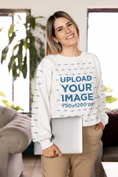 Gildan Sweatshirt Mockup Featuring a Smiling Woman Carrying a Laptop