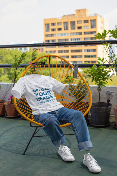 Round-Neck Tee Mockup Featuring a Ghosted Man Sitting in an Acapulco Chair