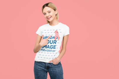 T-Shirt Mockup of a Happy Woman Pointing at Her Pink Ribbon for Breast Cancer Awareness Month