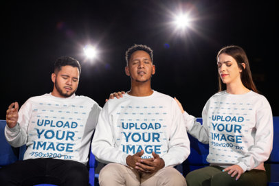 Christian-Themed Mockup of Two Men and a Woman Wearing Guildan Sweatshirts While Praying