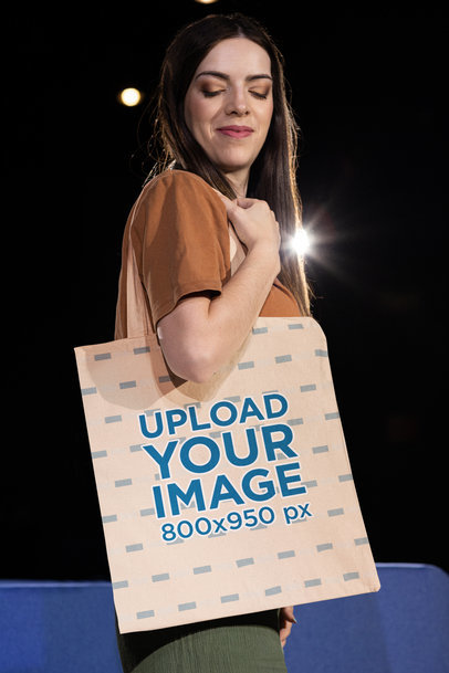 Sublimated Tote Bag Mockup Featuring a Smiling Woman Posing in a Christian Forum m34678