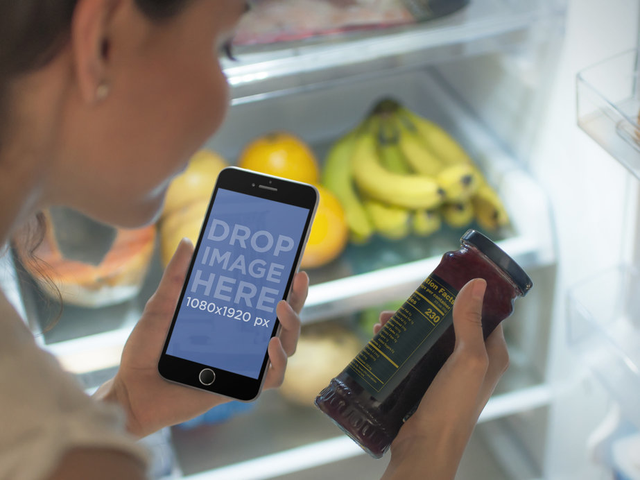 IPhone 6 Mockup of Woman With Open Fridge Looking at Nutritional Facts