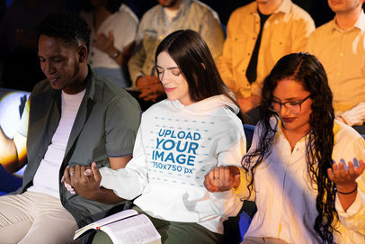 Gildan Hoodie Mockup of a Woman Holding Hands in a Group Prayer