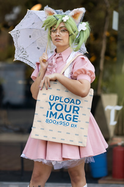 Tote Bag Mockup Featuring a Woman With Green Hair Wearing a Cosplay Outfit