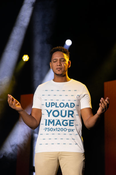 Bella Canvas Tee Mockup of a Man Saying a Prayer Inside a Forum