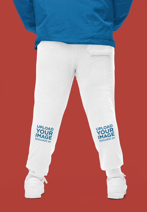 Back-View Sweatpants Mockup Featuring a Cropped-Face Man in a Studio