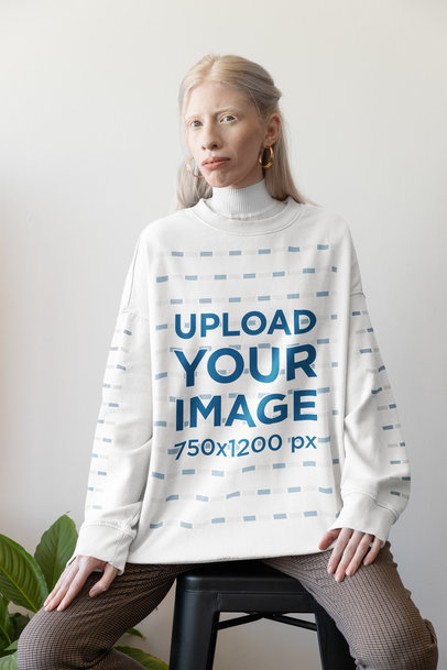 Mockup Featuring a Woman Wearing an Oversized Rounded-Neck Sweatshirt