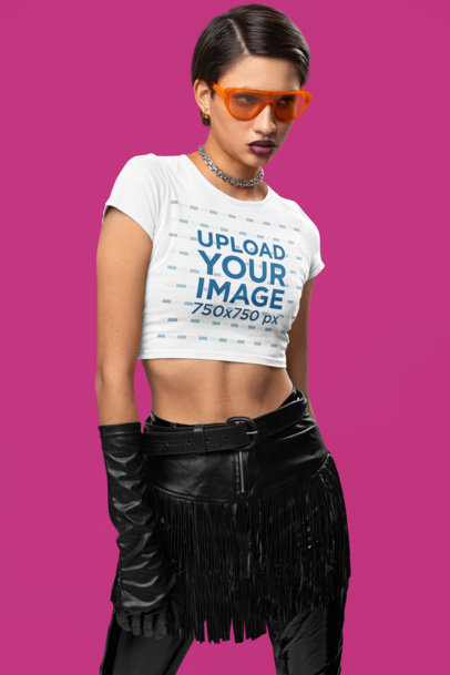 Mockup Featuring a Woman Wearing a Crop Top from Bella Canvas in a Studio