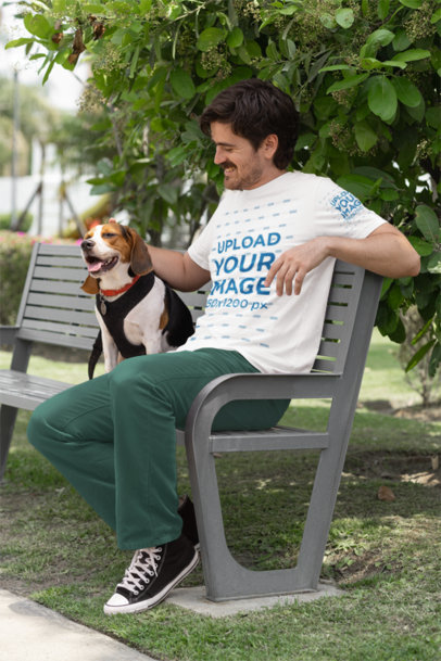 Bella Canvas T-Shirt Mockup of a Happy Man Petting His Dog in a Park