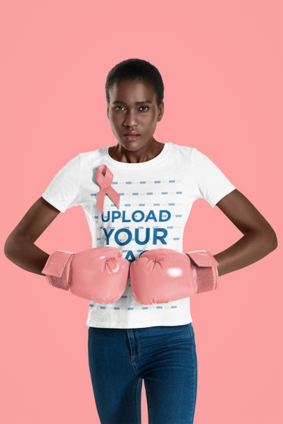 Tee Mockup of a Strong Woman with Box Gloves Wearing a Breast Cancer Awareness Ribbon