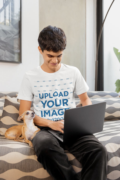 Bella Canvas T-Shirt Mockup of a Man Working on His Laptop with His Chihuahua Pet