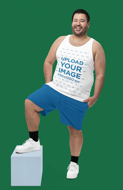 Mockup of a Smiling Bearded Man Wearing a Bella Canvas Tank Top at a Studio