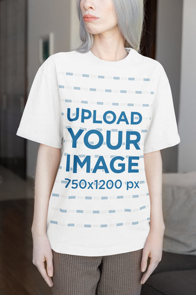 Mockup of a Woman with Gray Hair Wearing an Oversized T-Shirt at Home