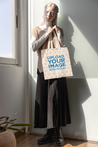 Mockup of a Woman Standing on a Corner Holding a Tote Bag
