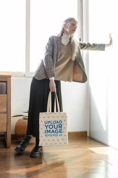 Tote Bag Mockup Featuring a Stylish Woman Carrying a Tote Bag With an Alternative Look