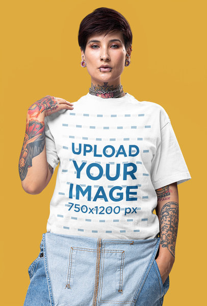 Oversized T-Shirt Mockup of a Tattooed Woman in an Alternative Style