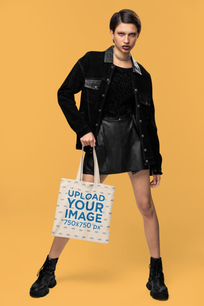 Alternative-Inspired Mockup of a Woman Carrying a Tote Bag in a Studio
