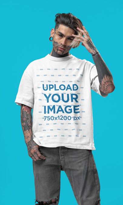 Oversized T-Shirt Mockup Featuring a Tattooed Man With an Alternative-Styled Look