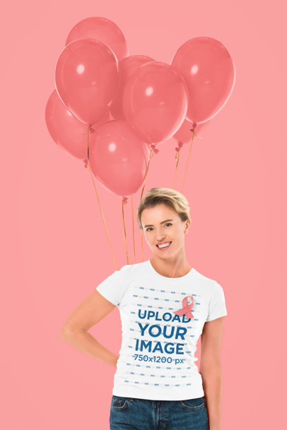 T-Shirt Mockup of a Woman Holding a Bunch of Balloons for Breast Cancer Awareness Month