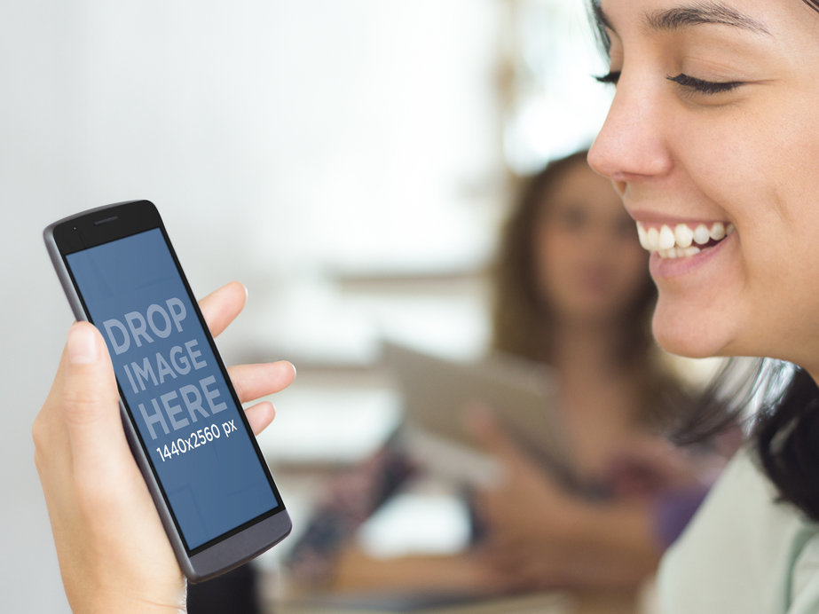 LG G3 Mockup Featuring a Young Woman Smiling While Using LG G3