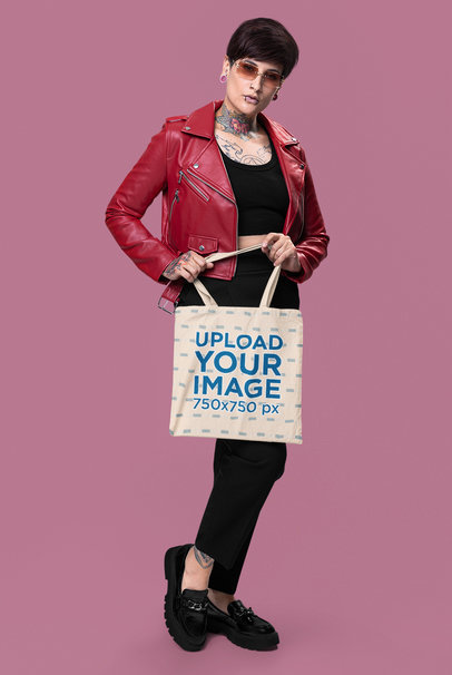 Tote Bag Mockup Featuring a Tattooed Woman With an Alternative-Themed Style