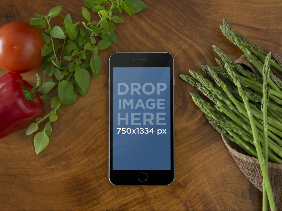 Mockup of Black iPhone 6 Laying Over Cooking Table