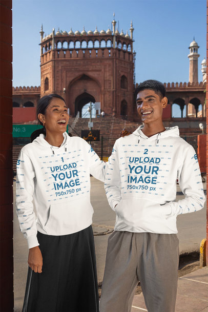 Gildan Hoodie Mockup of a Happy Couple Posing Near a Building
