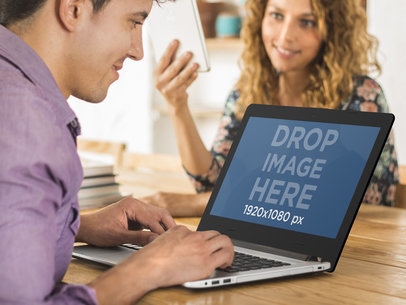 Asus Laptop Mockup Featuring Two Coworkers at the Office