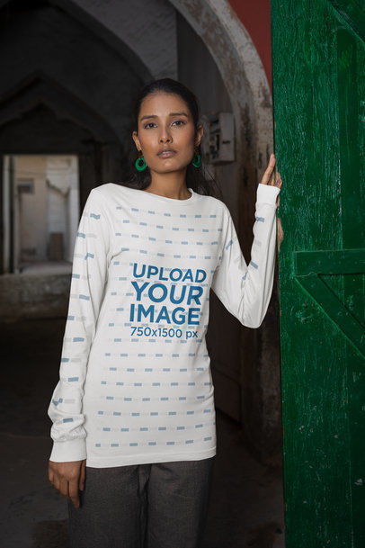 Bella Canvas Long Sleeve Tee Mockup of a Woman Posing by a Door
