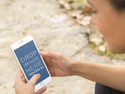 Woman Holding A Gold iPhone 6 While Working Out Outdoors