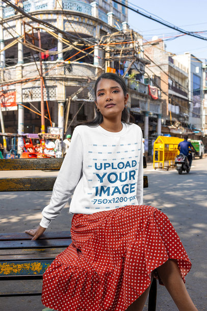 Sweatshirt Mockup Featuring a Woman Posing in an Old Bench m35351