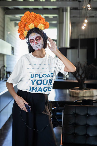 Mockup of a Woman with a Catrina Face Makeup Wearing a Stanley Stella T-Shirt m35485