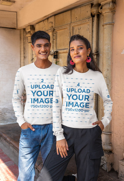 Mockup of a Smiling Couple Wearing T-Shirt with Customizable Long Sleeves