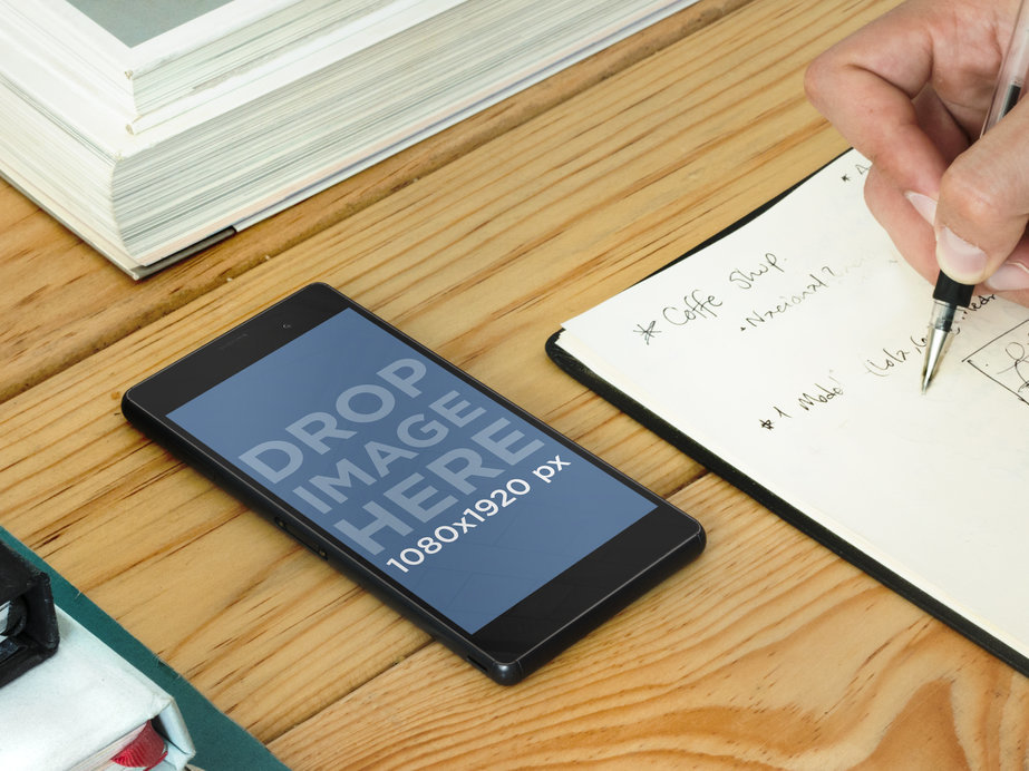 Sony Xperia Z3 Mockup Featuring a Young Man Taking Notes