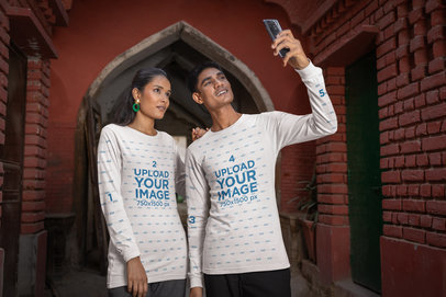 Bella Canvas Long Sleeve Tee Mockup of a Happy Couple Taking a Selfie
