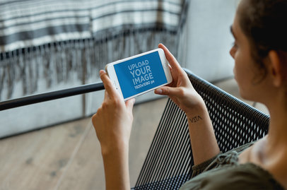 Gold iPhone 8 Plus Mockup Being Held by a Woman at her House