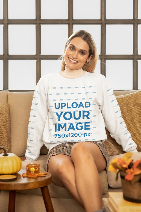 Thanksgiving-Themed Gildan Sweatshirt Mockup of a Woman Sitting at Home 