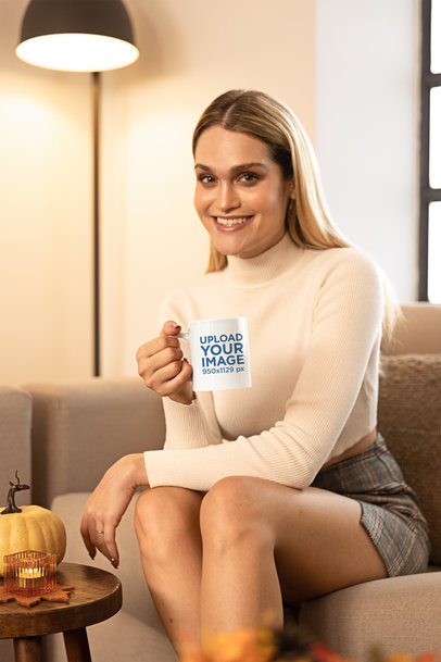 Thanksgiving-Themed Coffee Mug Mockup of a Woman Sitting in Her Living Room