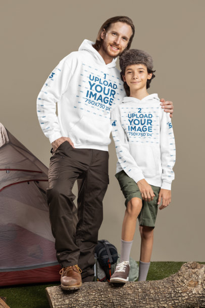 Gildan Hoodie Mockup Featuring a Happy Man and a Boy Posing in a Camping Setting