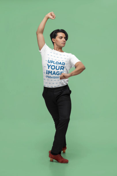 Bella Canvas T-Shirt Mockup of a Man Dancing in a Studio With a Customizable Background
