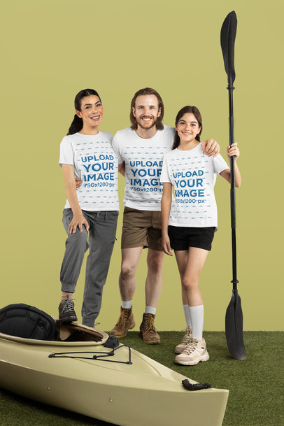Bella Canvas T-Shirt Mockup of a Girl and Her Parents Posing With a Kayak