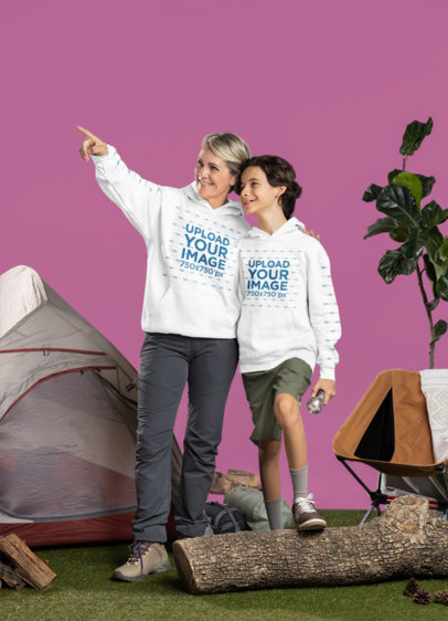 Gildan Hoodie Mockup Featuring a Happy Senior Woman Hanging Out With a Boy While Camping