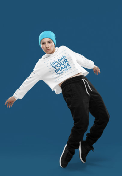 Crop Top Hoodie Mockup Featuring a Woman Breakdancing in a Studio