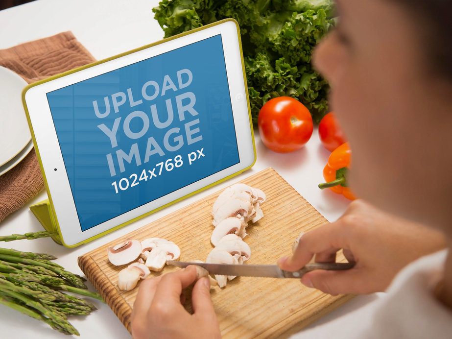 iPad Mockup of Woman Using White iPad While Cooking Dinner