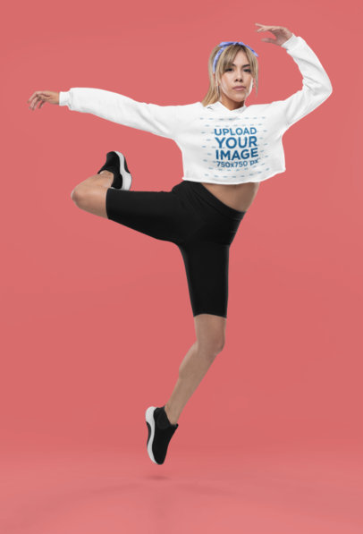 Crop Top Hoodie Mockup Featuring a Serious Dancer Woman in a Studio